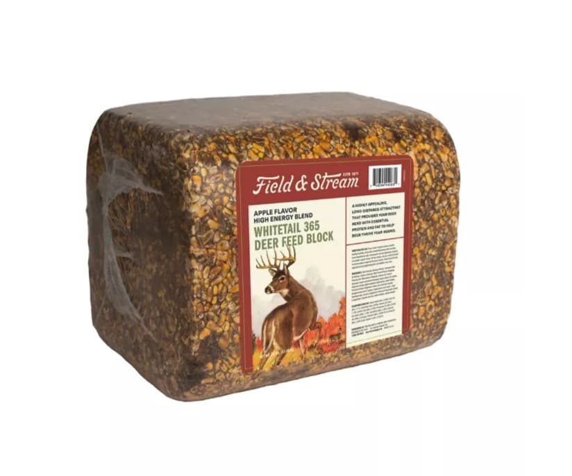 A 30 lb Field & Stream Whitetail 365 apple-flavour deer feed block, a shrink-wrapped brick of pressed grain with a red label showing a whitetail buck.