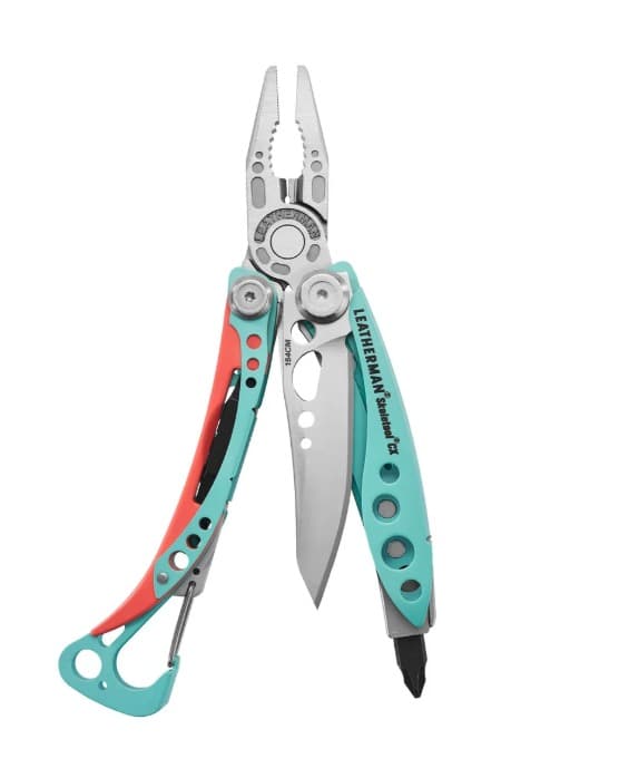 Leatherman Skeletool CX in the Paradise colourway, opened out with the pliers at the top, the black 154CM blade swung out to the right and the teal carabiner handle with a coral scale at the bottom.