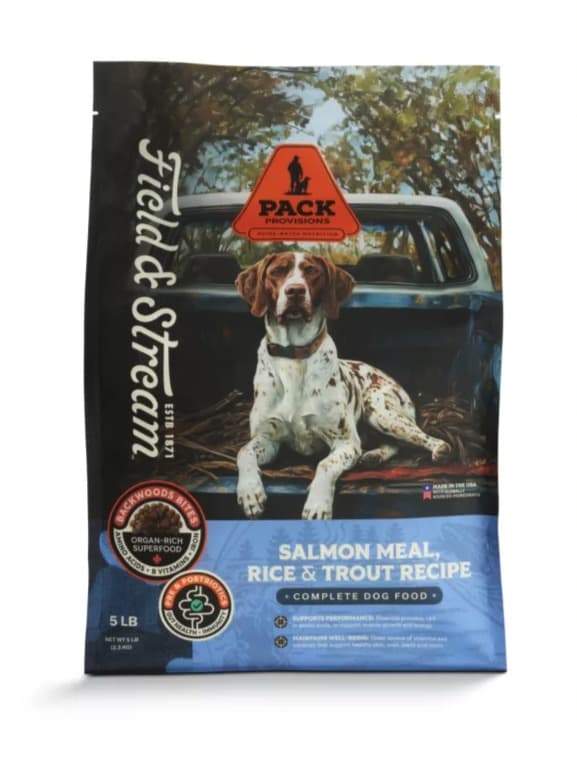 A 5 lb bag of Field & Stream Pack Provisions Salmon Meal, Rice & Trout Recipe dog food, a German shorthaired pointer lying in the bed of a pickup on the front, the Field & Stream script down the left edge and a blue band along the bottom.