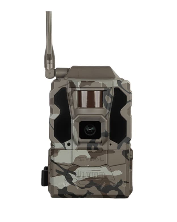 Tactacam Reveal X Ultra 3.0 cellular trail camera in brown camouflage, face-on, with the antenna standing up from the top left corner and the lens and IR window on the front.