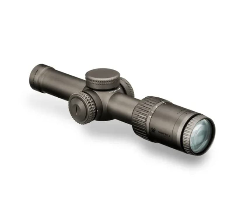 A Vortex Razor HD Gen II-E 1-6x24 riflescope in dark bronze, lying diagonally on white with the objective lens toward the camera, capped turrets and the illumination dial on the left side.