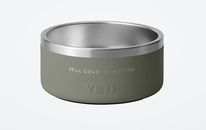 YETI Boomer 8 dog bowl in Pampa Green with HILL COUNTRY HITTERS engraved across the front above the YETI mark.